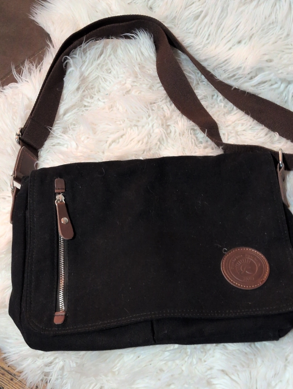 AugurStrauss&Co Vintage Messenger Bag with Brown Trim Accents.